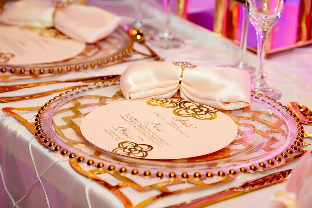 Place setting-White satin linens, glass plate with gold accents